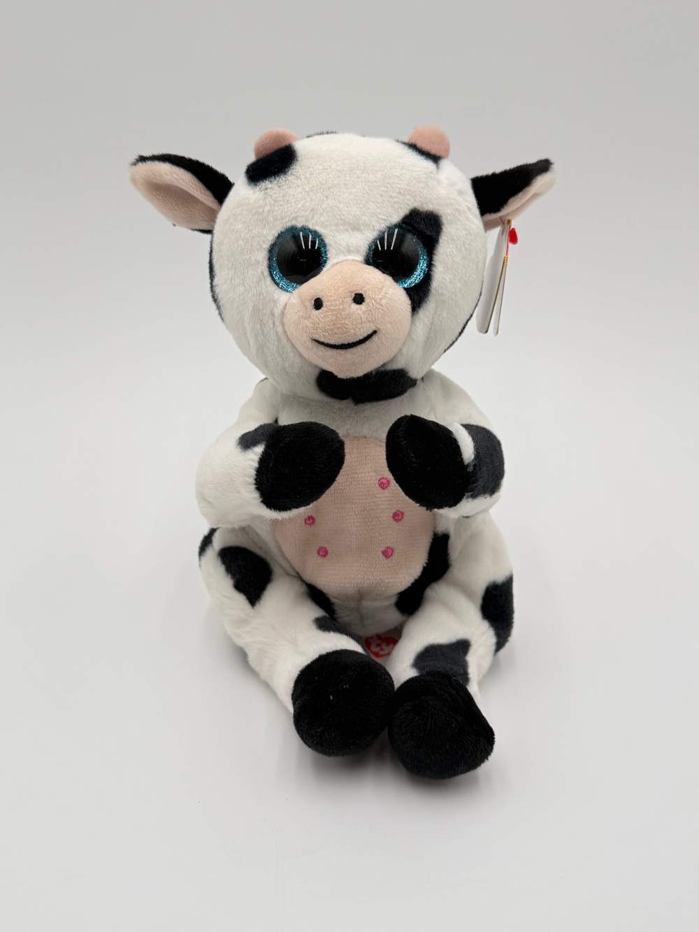TY Beanie Bellies Herdly Cow Plush 2023 Black White Blue Eyes Heart Tag